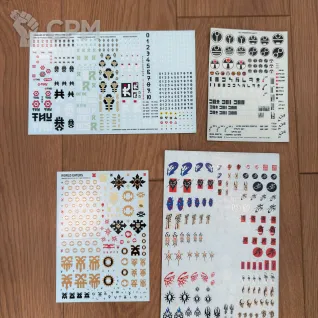 Описание картинки Ассорти Decals (World Eaters, Leagues Of Votann, Tau, Drukhari) от Miniatures Broker по цене 400руб | Свободный Рынок Миниатюр - СРМ